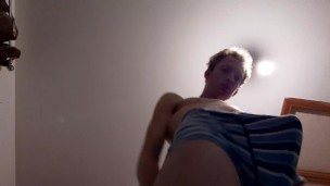 Skinny teen has a massive bulge while wearing his boxers