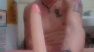 Twink rides 7″ dildo in bathroom